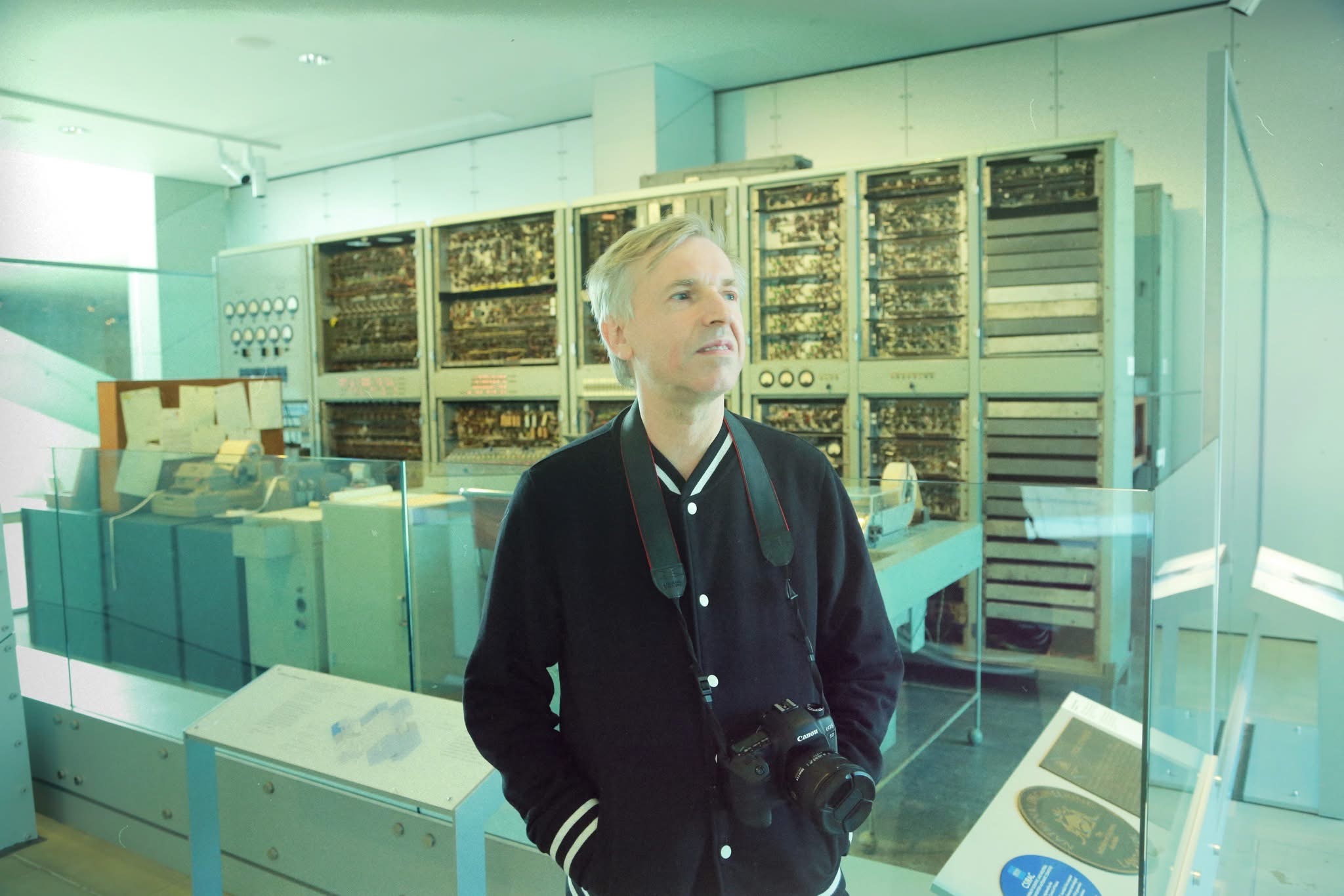 David Pearce standing in front of CSIRAC - Australia's first electronic computer