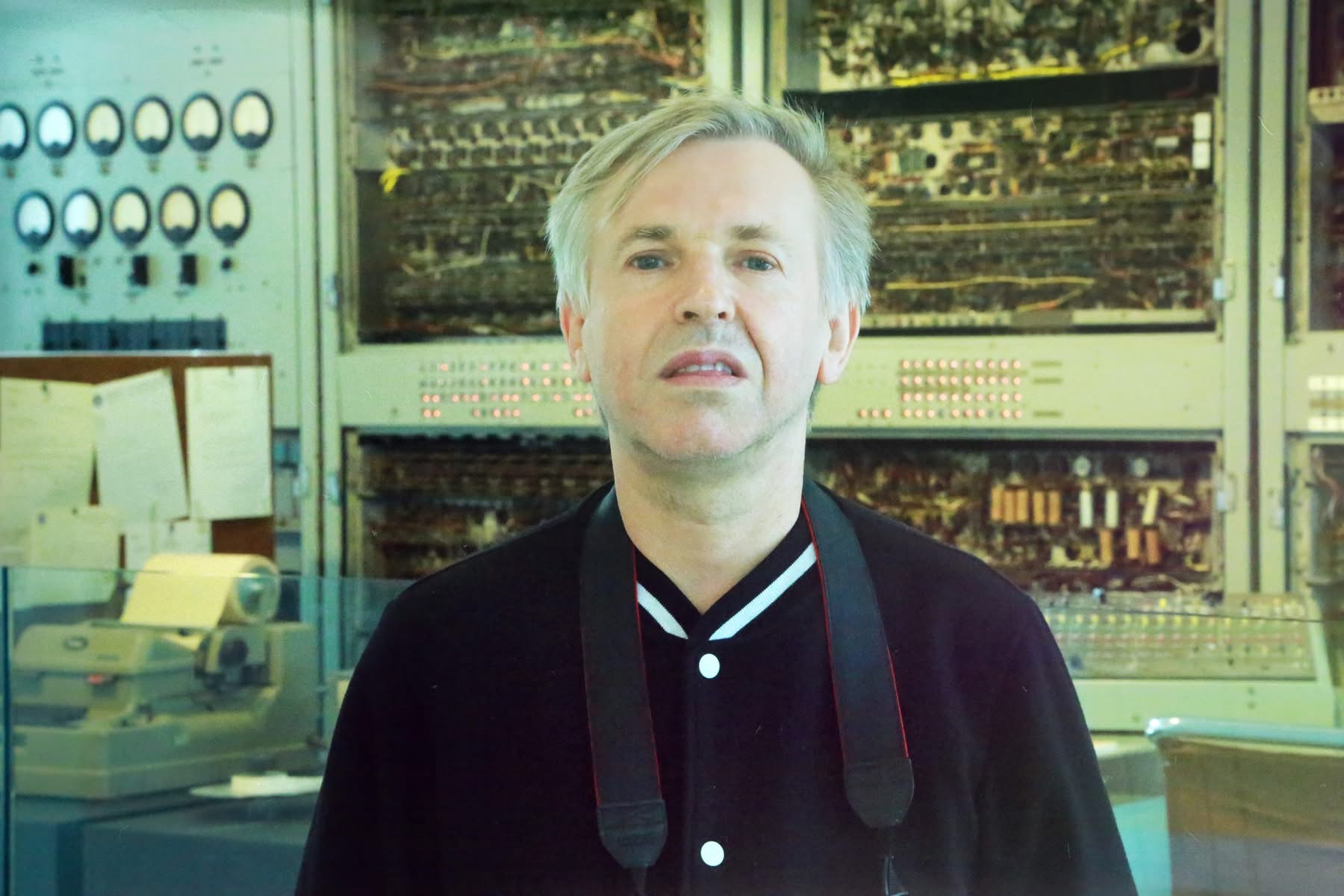 David Pearce standing in front of CSIRAC - Australia's first electronic computer